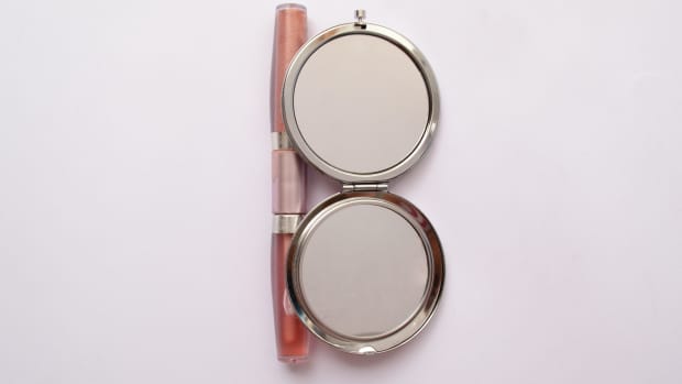 lip gloss and a mirror compact