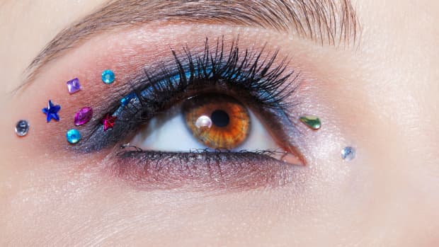 close up of an eye with rhinestones around it