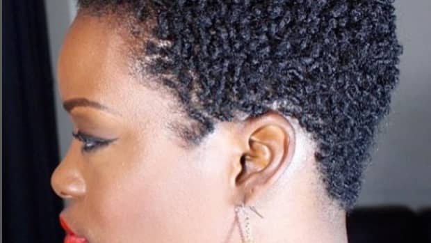 close up of a Black woman with a TWA