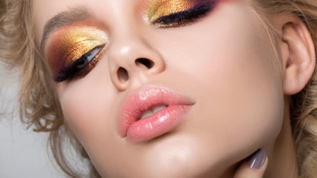 a woman with multicolor eyeshadow on