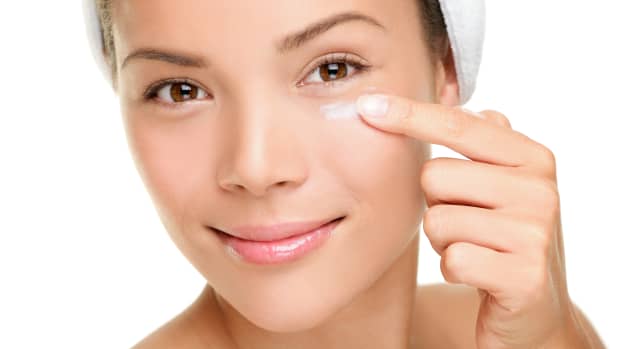 woman applying eye cream