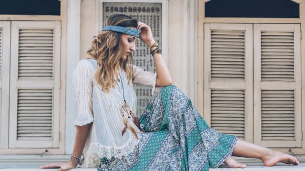 woman poses in boho outfit.
