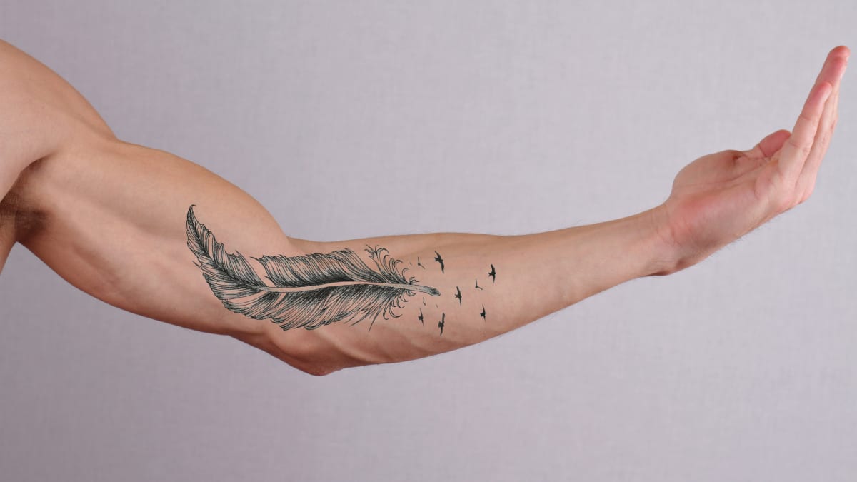 Feather tattoo by Kafka Tattoo | Post 26089